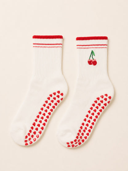 Cherry Bliss ruffle grip socks worn for pilates at home
