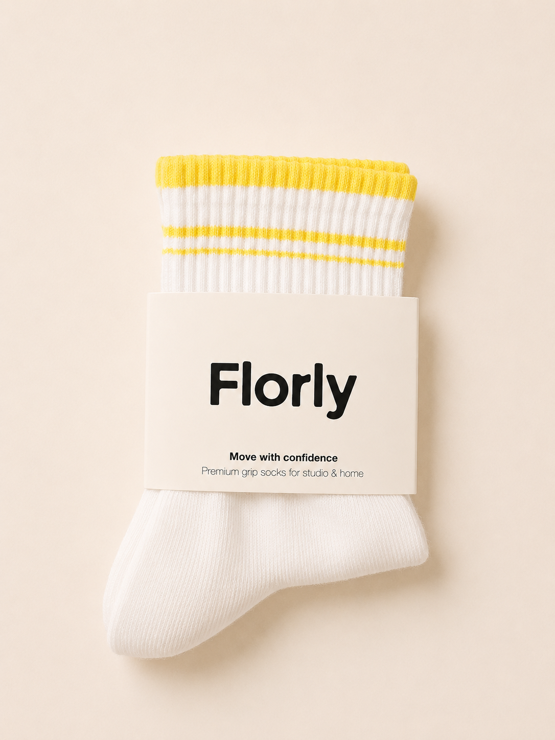 Close-up of Lemon Glow grip socks showing the non-slip grip sole